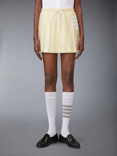 OXFORD 4-BAR DRAWSTRING PLEATED MINI SKIRT PALE YELLOW