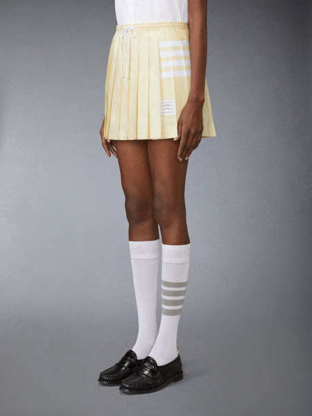 OXFORD 4-BAR DRAWSTRING PLEATED MINI SKIRT PALE YELLOW