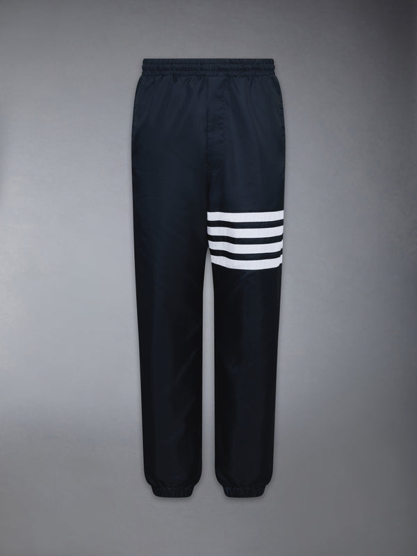 SHINY RIPSTOP 4-BAR TRACK PANTS - featured image